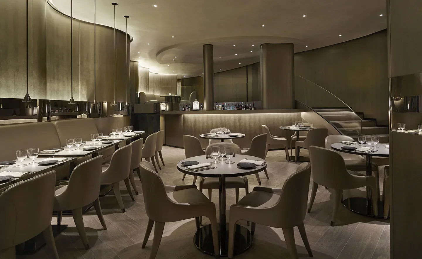 Elegant interior of Armani Ristorante in Paris, featuring modern design and dining tables.