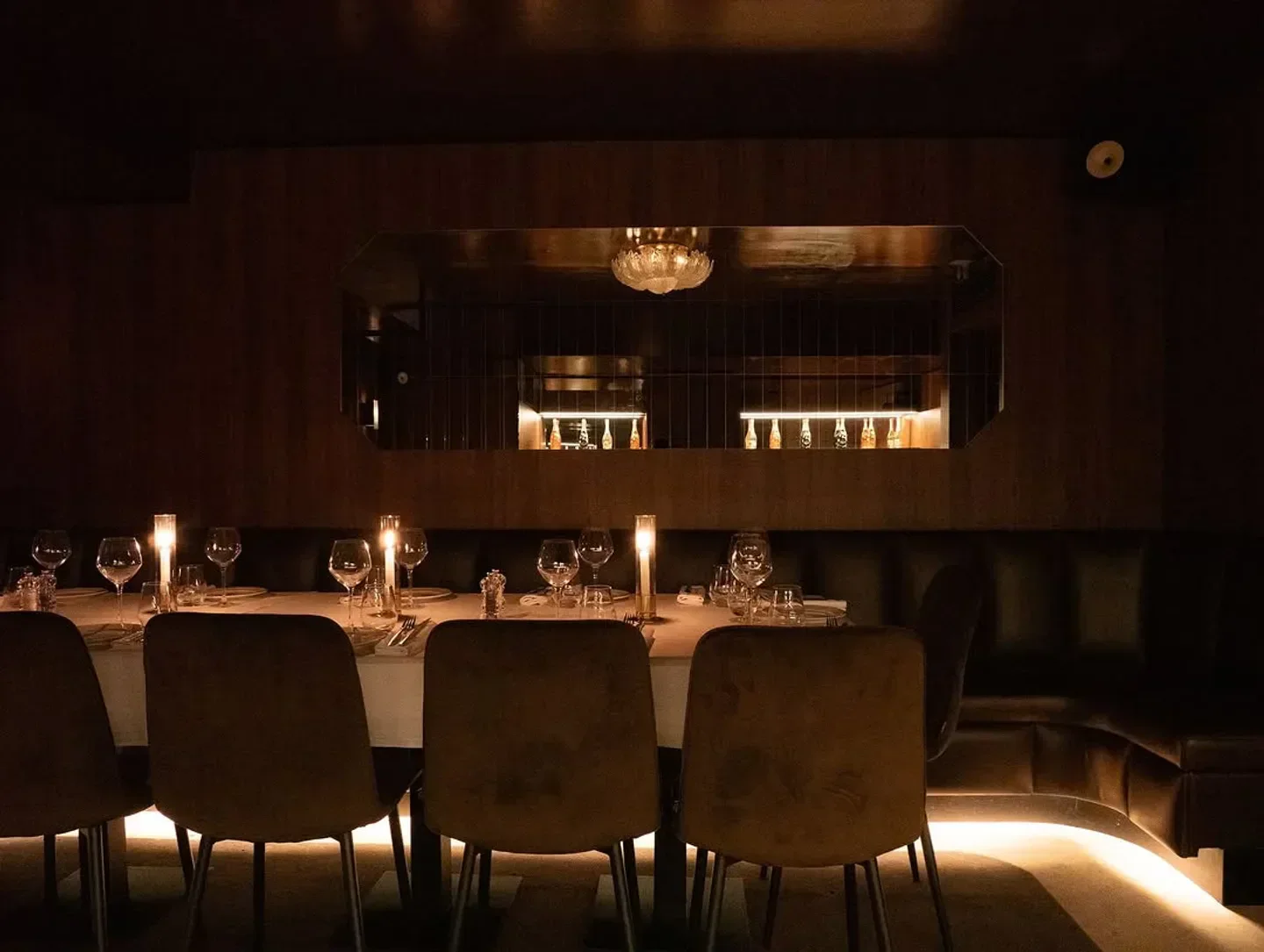 Elegant dining at Giulia restaurant in Paris, featuring candlelit tables and stylish decor.