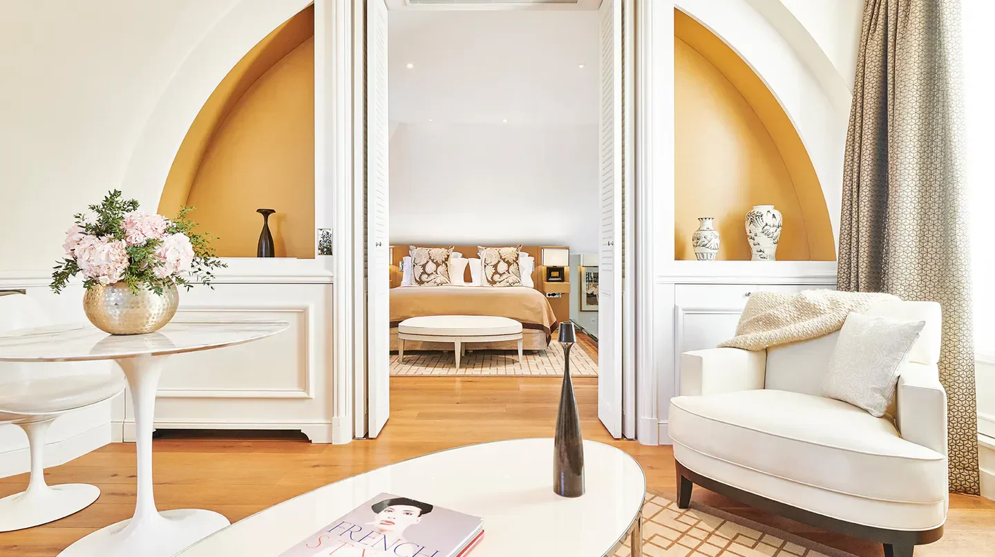 Elegant bedroom interior at Grand Hôtel du Palais Royal, a luxurious hotel in Paris.