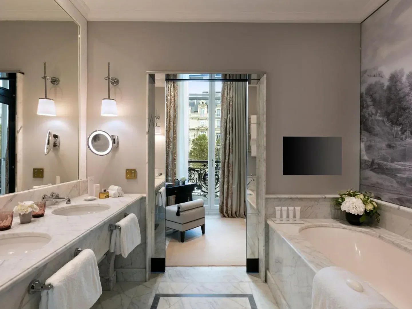 Elegant bathroom at Hôtel Barrière Le Fouquet's Paris, featuring marble and Parisian views.