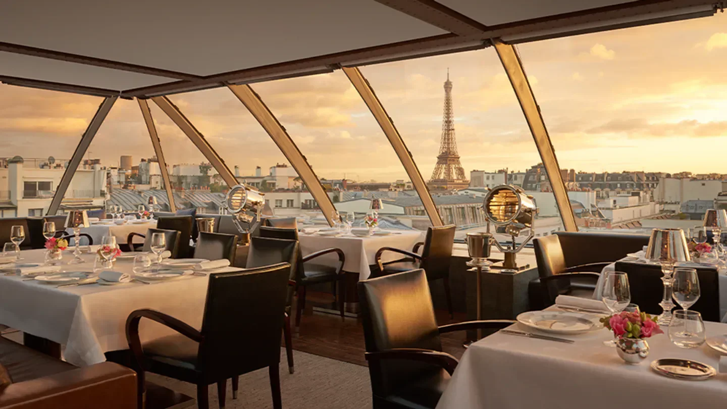 L'Oiseau Blanc restaurant in Paris with a view of the Eiffel Tower at sunset