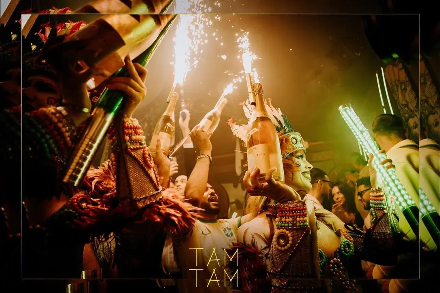 Celebration at Tam Tam nightclub in Paris, with performers, champagne, and festive atmosphere.